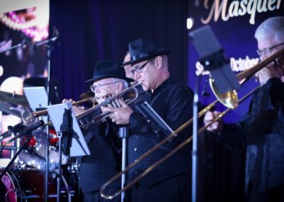 Live band performing on stage at a past Night of Light gala