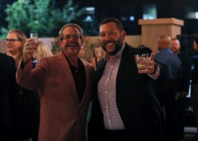 Two guests raising a toast at the Night of Light evening reception